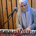 Syrian singer Ghalia Chaker plays a keyboard. — AFP/File