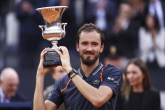 Medvedev lifts the Italian Open trophy after defeating Rune.