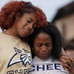 People attend a vigil at Jug Tavern Park following a shooting at Apalachee High School