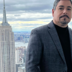 James Caban in front of the NYC skyline